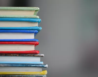 Image shows a stack of books