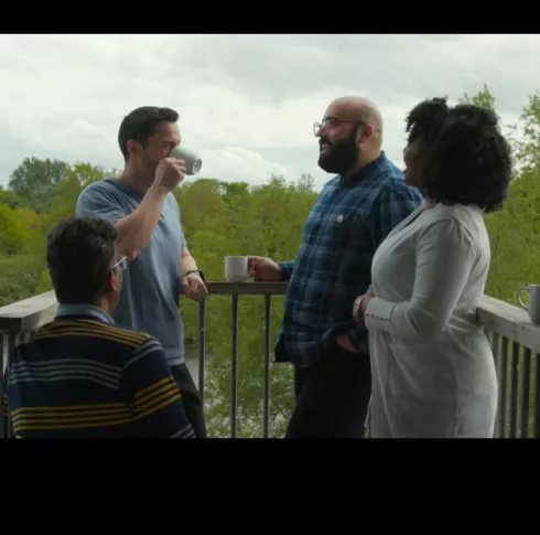 People talking on a balcony