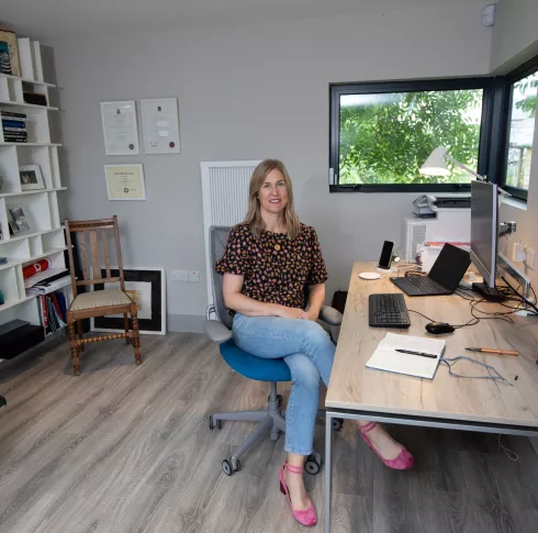 Siobhan Ryan sitting in office