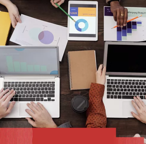 laptops and charts on a table