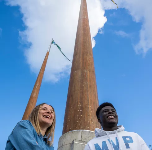 Students at UL flagpoles