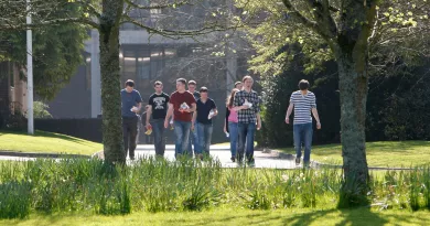 Students walking in sun