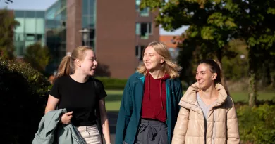 3 students chatting during orientation