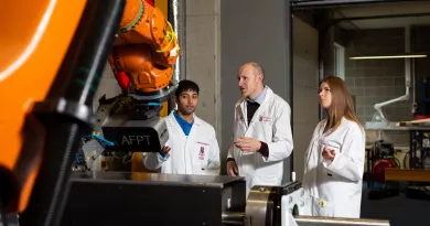 Students in a lab with a lecturer