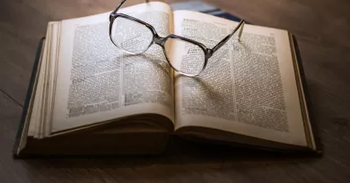 open book with glasses