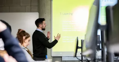 Image of a staff member presenting to students