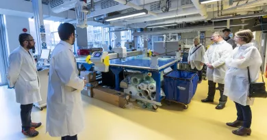 a group of researchers in white coats