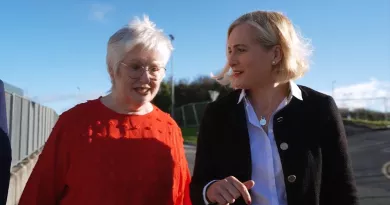 Two women walking and talking