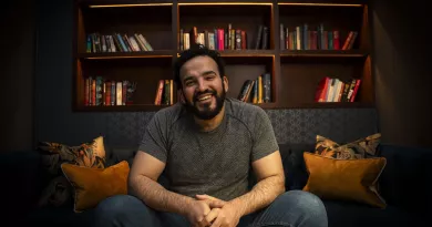 Mostafa Darwish, seated and smiling at camera