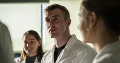 Dr. Joseph Mooney with colleagues in lab coats at University of Limerick