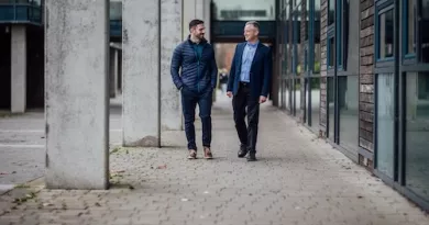 two men walking in UL