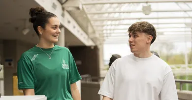 Male and Female Undergraduate Students inside a building