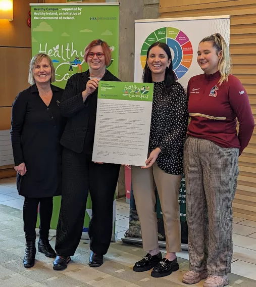 A group pictured at the charter signing in UL