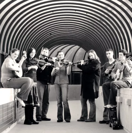 group of students pose with their instruments 