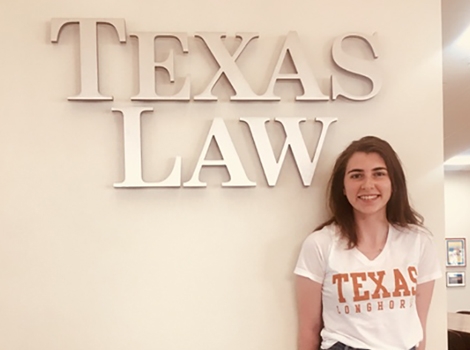 Eilbhe pictured in front of a Texas Law sign