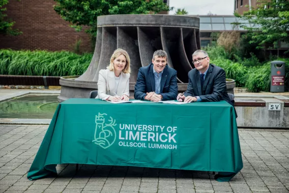 The trio pictured at the signing in UL