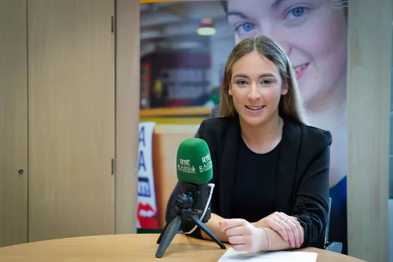 Emily Greaney pictured in front of a microphone