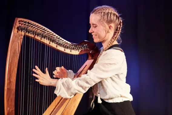 woman playing harp