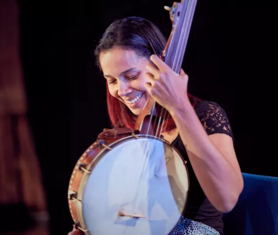 Rhiannon playing a banjo