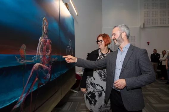 UL President Kerstin Mey gets a look at the Vicky Phelan portrait, with portrait owner David Brennan