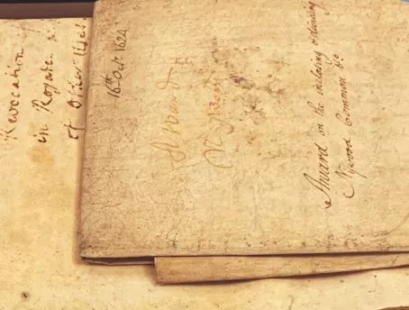 very old stained pages with old style text written on it