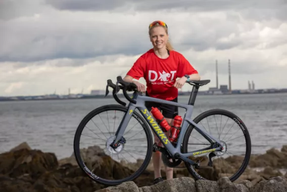 Carolyn Hayes posing with a bicycle