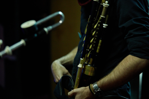 Person playing uilleann pipes