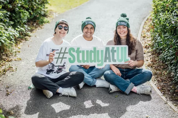 UL students holding a 'Study at UL' sign