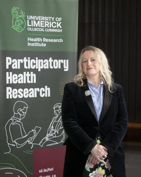 Anne Cronin with PHRU Banner.