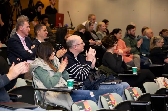 A group of people applauding