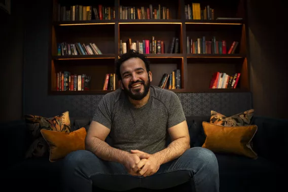 Mostafa Darwish, seated and smiling at camera