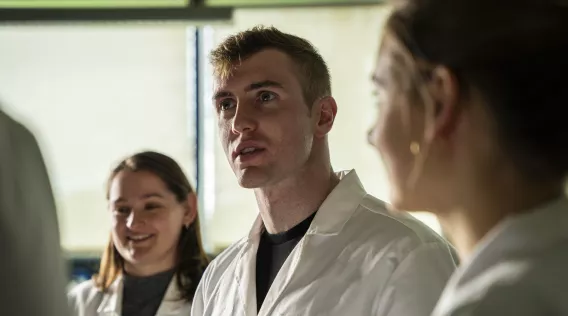 Dr. Joseph Mooney with colleagues in lab coats at University of Limerick