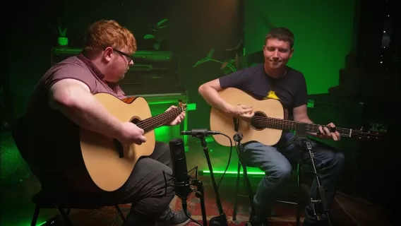 Marty Barry and Conal O’Kane playing their guitars together