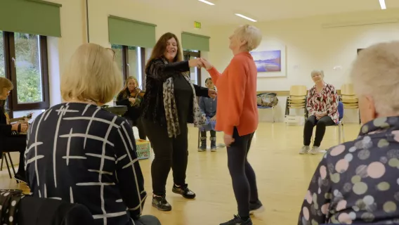 Older adults attending the seminar which features movement and music.