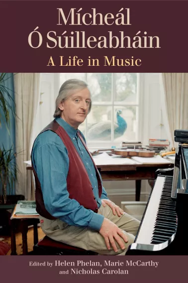 Book cover of "Mícheál Ó Súilleabháin A Life in Music" showing him sitting at a piano.