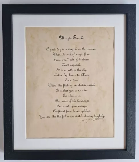 A photo of a framed poem called 'Magic Touch'