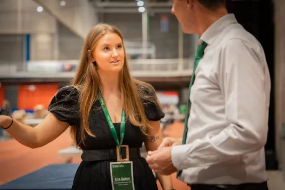 Exhibitor speaking to a student at Careers Fair 