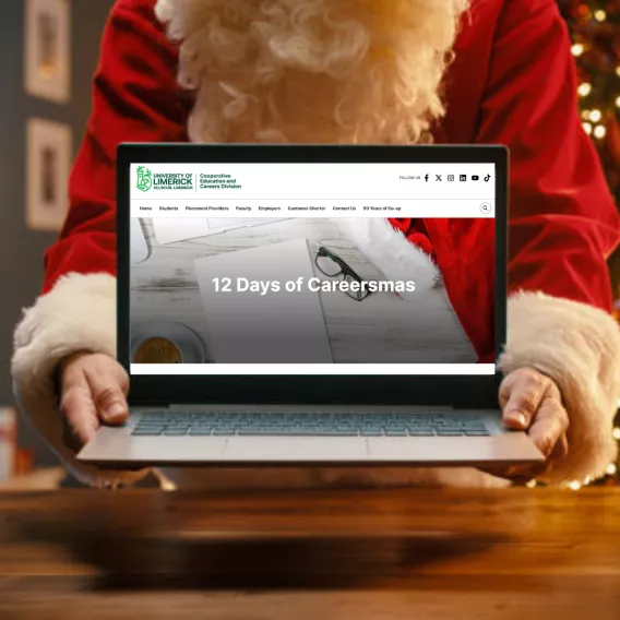 Santa holding laptop with 12 Days of Careersmas image