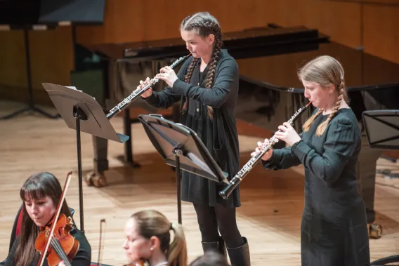 Two student playing the oboe