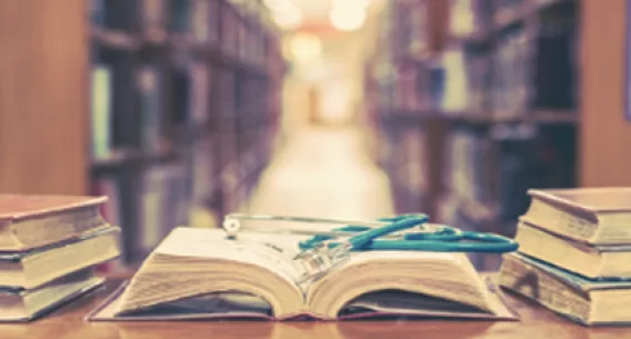  Photo of a book open with a stethoscope on it