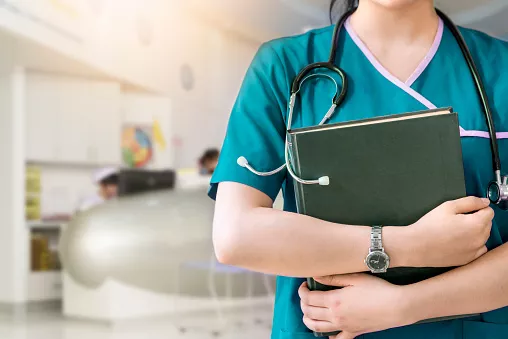 Person with stethoscope and laptop