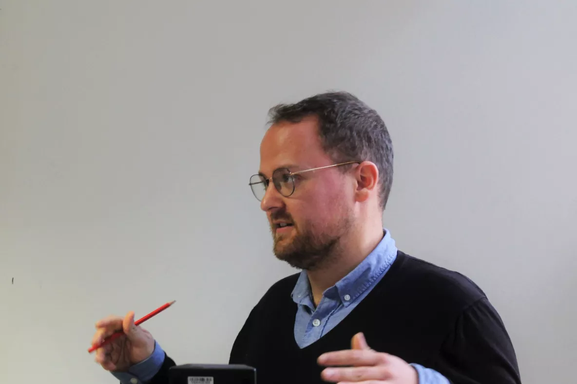 image shows Jonas Hirschi presenting 