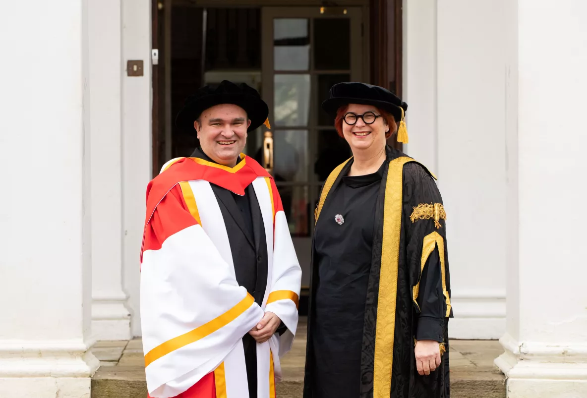 A picture of Jörg Widmann with UL President Professor Kerstin Mey