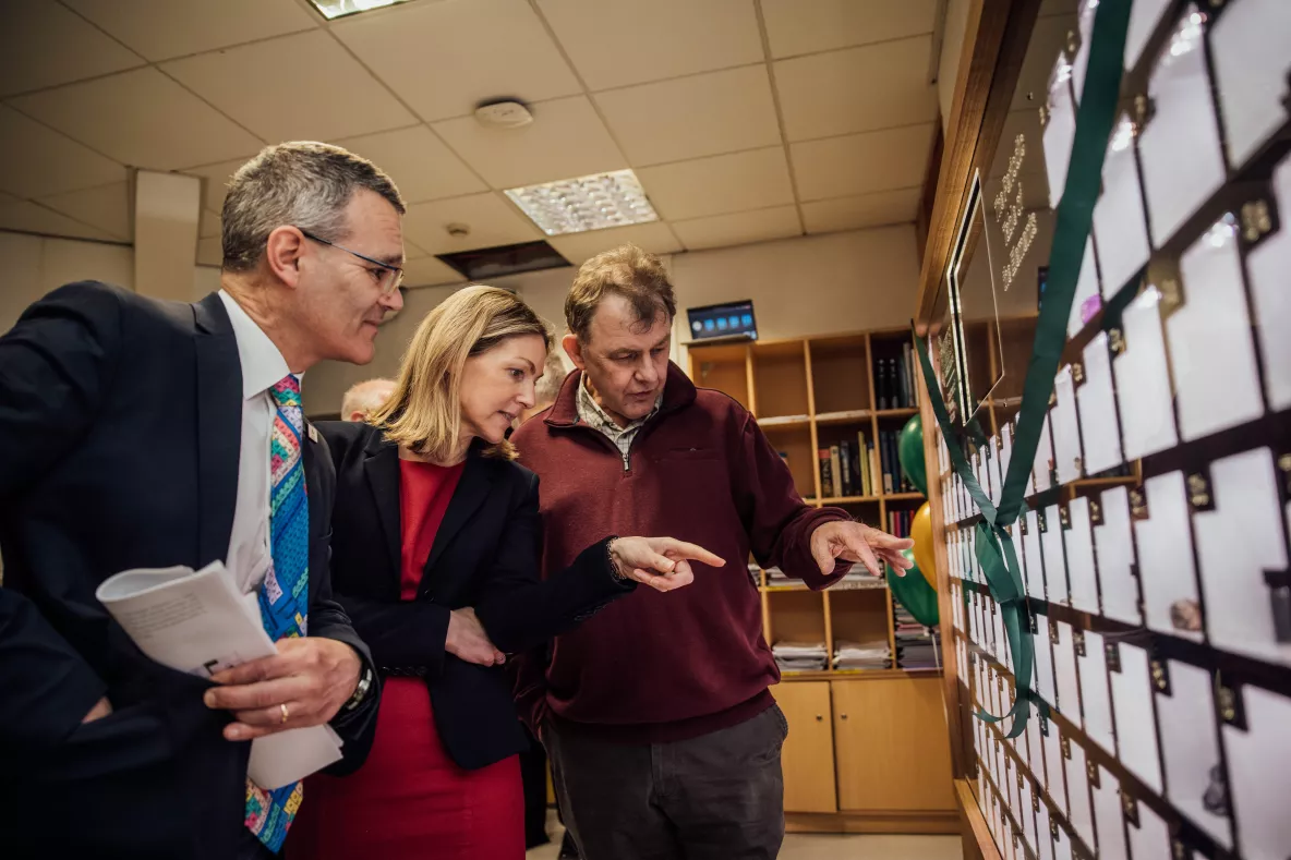 A group pictured in UL looking at the periodic table