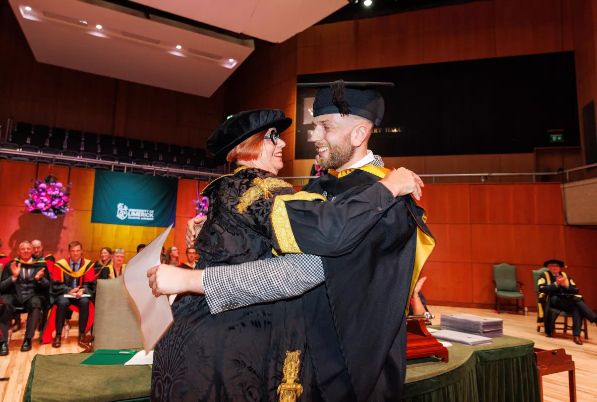 UL President Professor Kerstin Mey hugs her son, who was graduating from the university