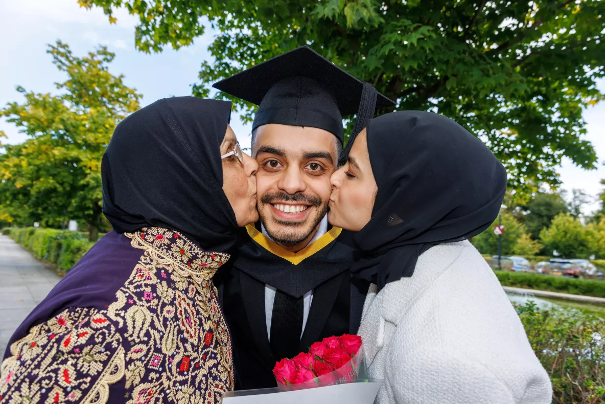 Saleem with his mum and his fiancé pictured after his graduation at UL