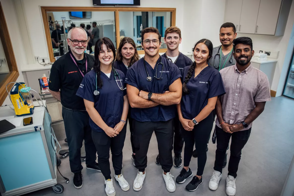 A picture of a group of students and their tutors in the new clinical simulation lab