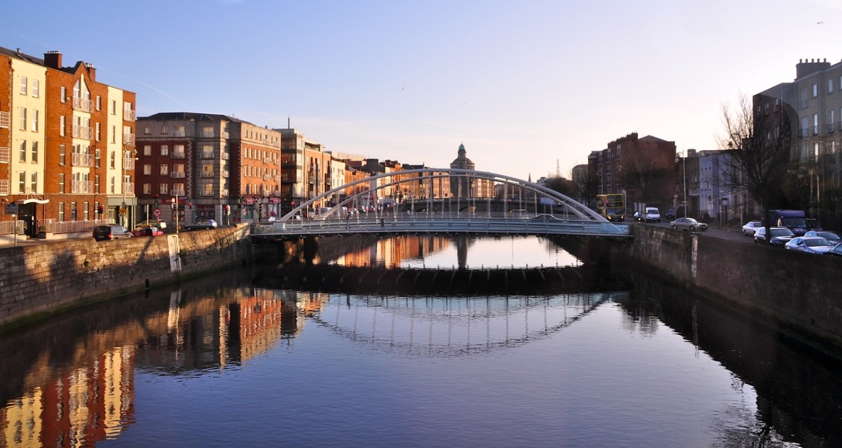 Ha'penny bridge, Dublin on clear day reflecting on the river