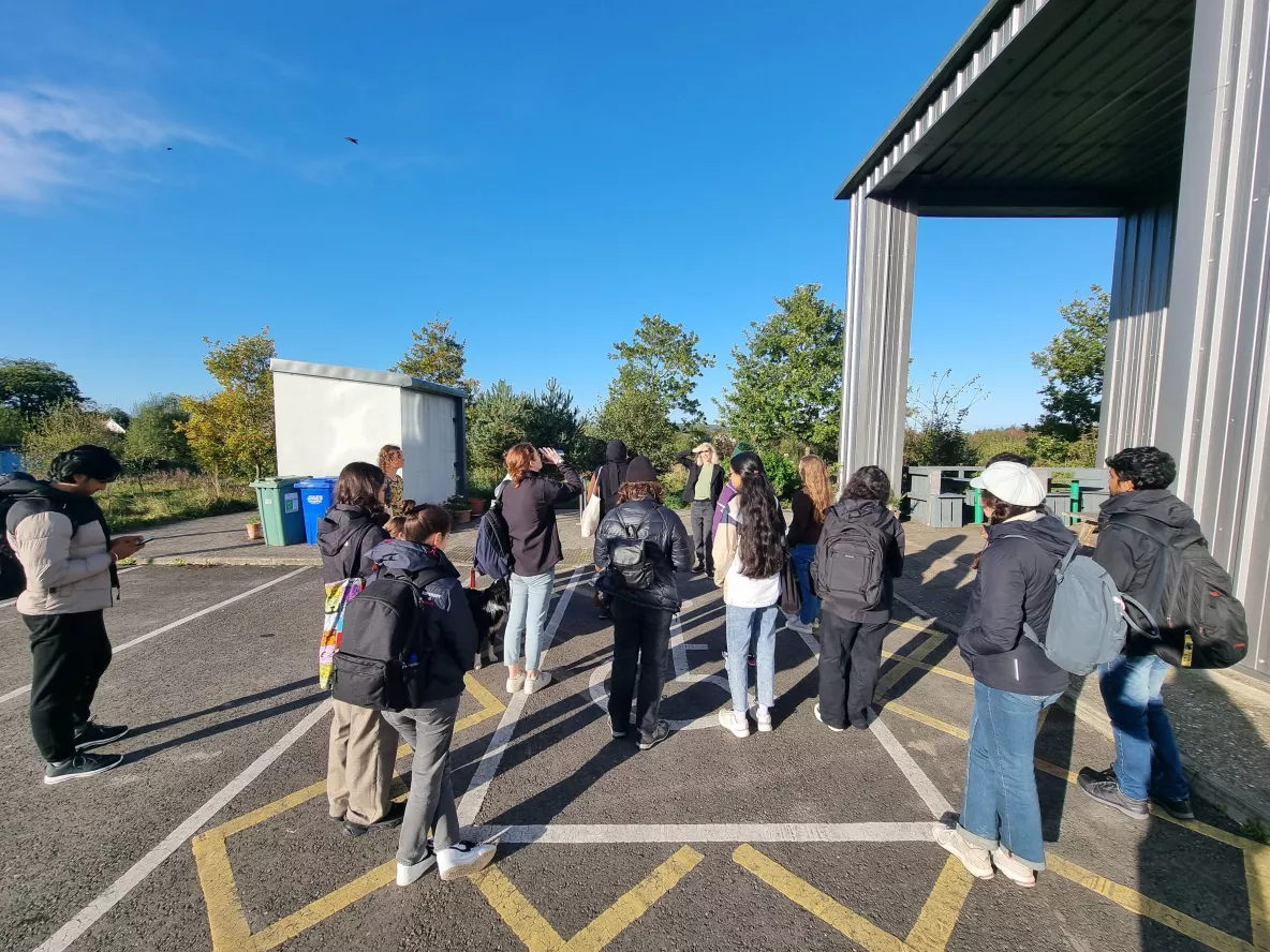 A group of students greeted by Cloughjordan Eco Village