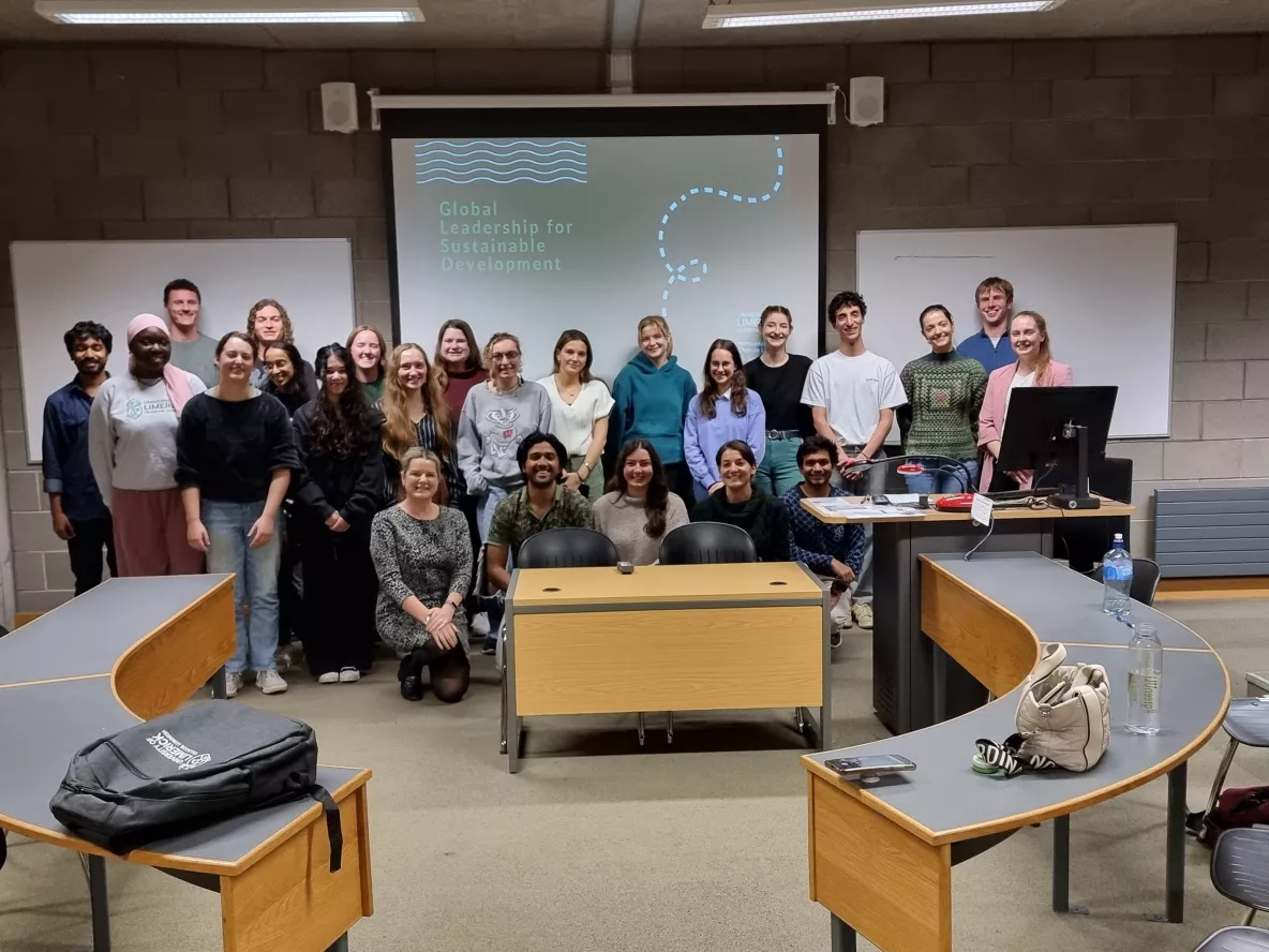 Cohort 1 of GLSD at the front of the presentation room